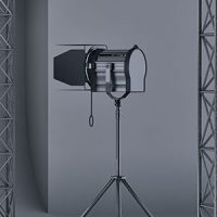 A light stand with a tripod in front of it.